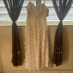 Long white dress with butterflies.